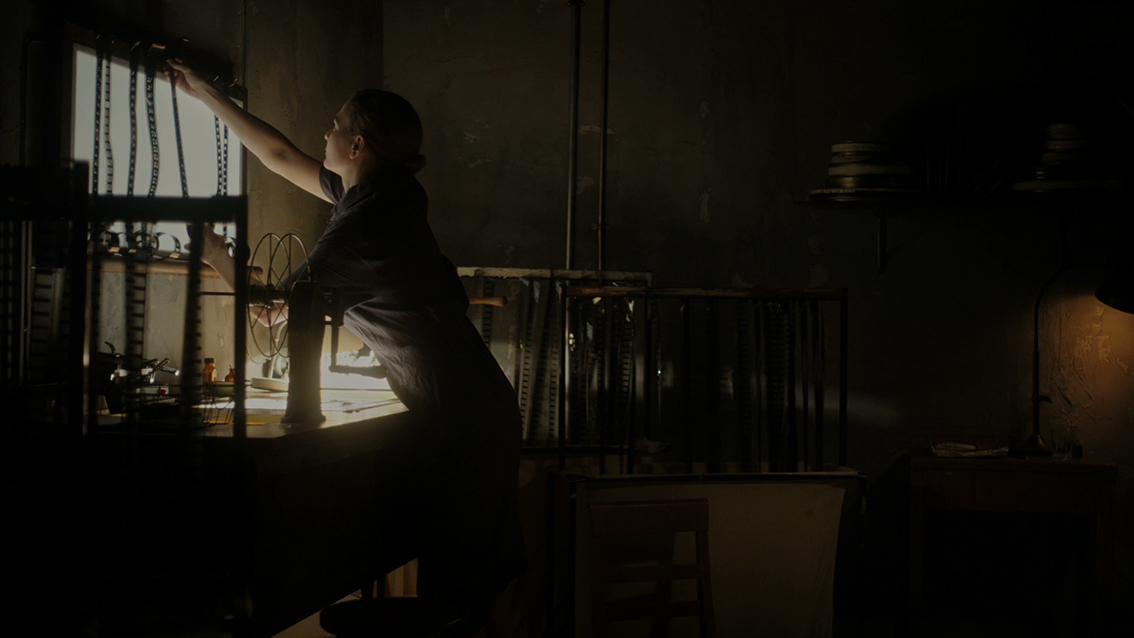 Leeanna Walsman as Svilova, composing a sequence in 'Woman with an Editing Bench' ©2016 The Physical TV Company